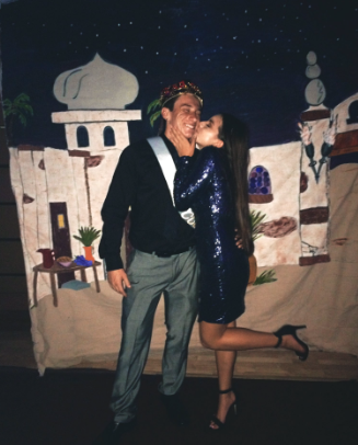 Zak Murray receiving a congratulatory kiss from   his date, Briana Aguilar.