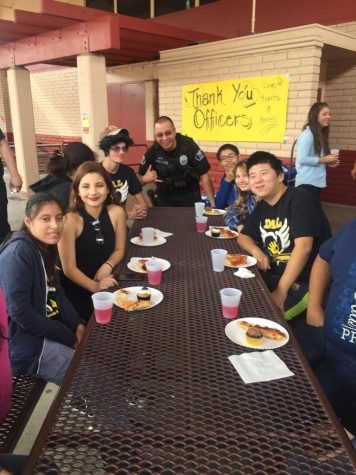 Here officer Kato is conversing with some students enjoying their delicious food. Kato is the resource officer here on campus willing to talk to any of the students here. Photo courtesy to Natalie West.