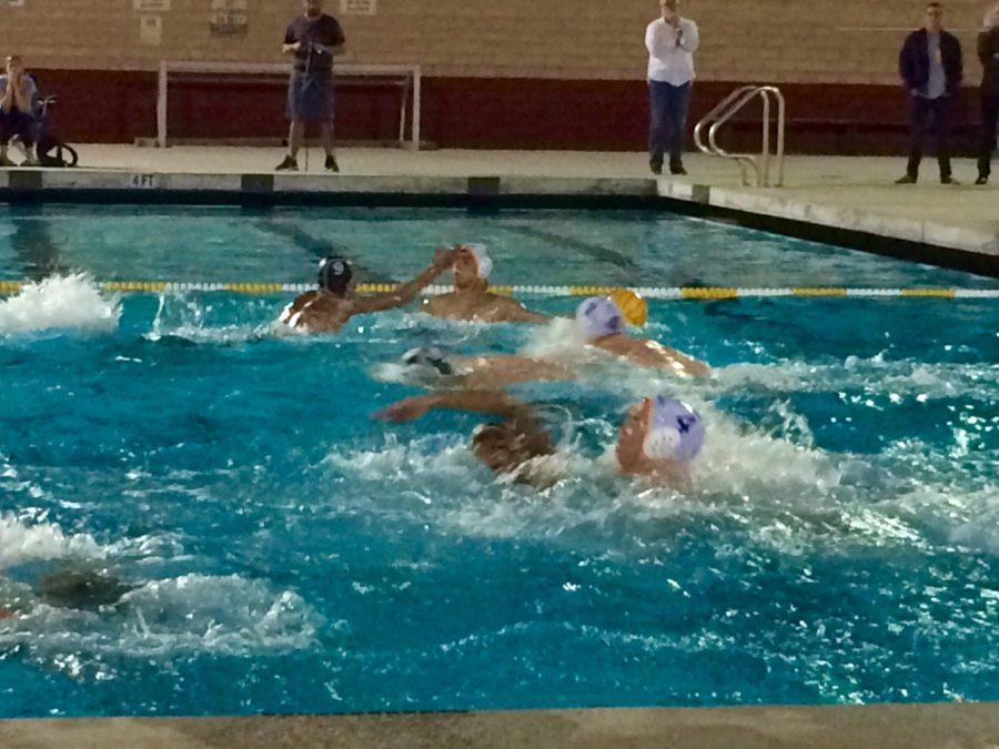 Don Lugo (dark caps) swimmers defending their goal at all cost. Josh Ibarra explained,  We had some mental errors that kept the other team in the game but we pulled through. All students and staff are cheering on water polo and continues to support the team. 