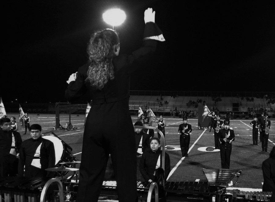 Displayed is Lugo Drum Major, Meranda Rouse as she conducts the Marching Conquistadors in their show on Friday night. The show titled Case Closed is evidence of the significant improvements in the band program. The Conquistadors will continue performing in upcoming competitions. 