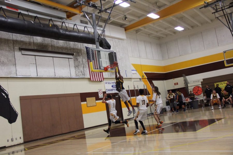 Coach Wilson slam dunks the ball into the net. It was a great experience and I hope to be able to do that again next year, stated Robert Sosa.