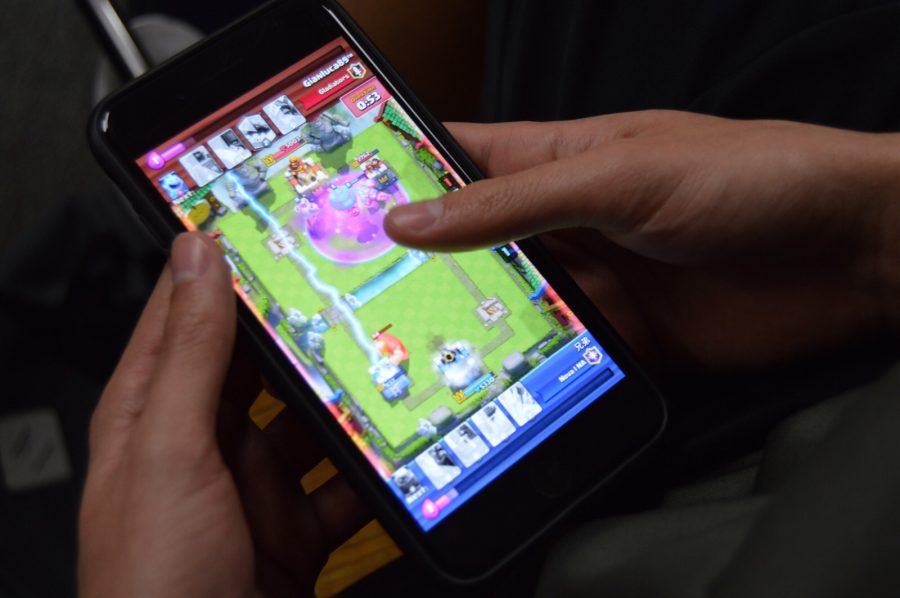 A Don Lugo student is seen watching a playback of a previous thrilling match. Clash Royale has many Lugo students hooked, creating a community among the clashers. The app was named the Best Mobile Game of 2016 by multiple technology reviewers.