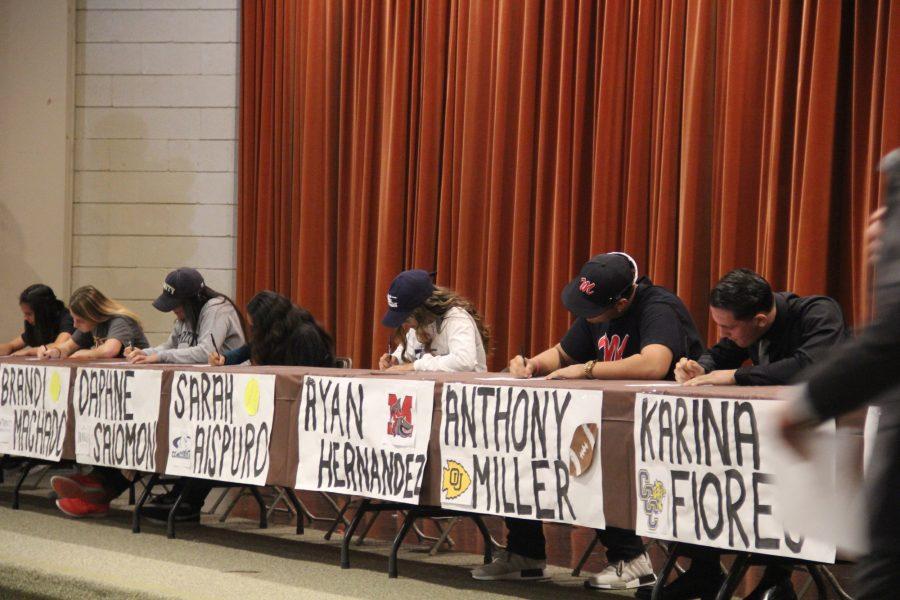 The signing table for 11 athletes was set up in the MPR to honor and congratulate those accepting serious college offers.  These eleven students are the first to participate in a new Life After Lugo: Sports Edition tradition for Lugo. This was a very exciting moment for all of us kids, especially in front of loved ones, expressed Brandi Machado.