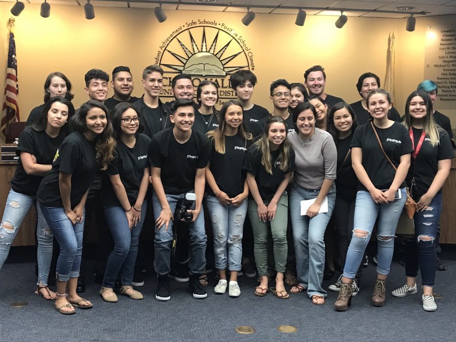 Quest reporters attend District Board meeting. The students smile for a picture after the presentations. Photo courtesy of principle, Dr.Cabrera. 