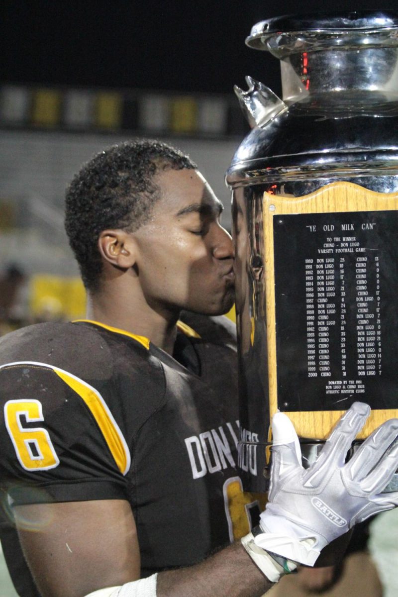 Varsity football player Khoury Bethley kisses the milkman after keeping it home where it belongs.