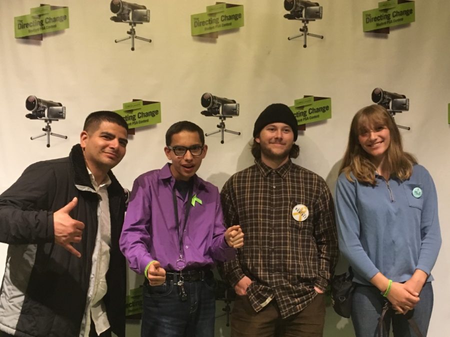 Digital Video Adviser, Brian Garcia, and students Aiden Deming, Jake Swartz, and Student Director, Shaiyanne Leeming pose at the California Performing Arts Theatre for the 6th Annual Inland Empire Screening & Award Ceremony of the Directing Change Film Contest. 