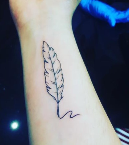 Melody Hemsings ink and quill tattoo on her right arm.  She loves what it means to her, as she is a passionate writer and this is a way for her to show it to the world.  (Melody Hemsing)