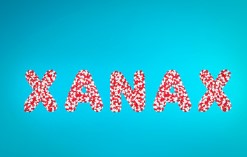 Image of the word Xanax made out of red and white pills.