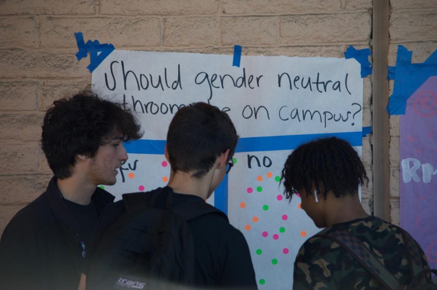This poster, among the many plastered around campus; all had supervising reporters to explain in further depth what the question was proposing. Once students fully understood the meaning of the question, they were handed a sticker to voice their opinion with the choices yes or no.