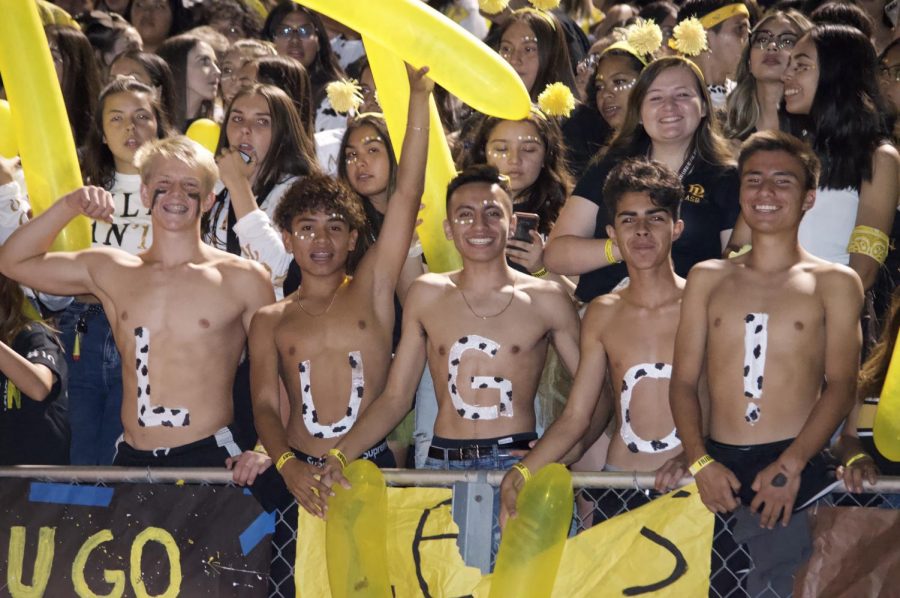 Full Of Spirit. Five conquistadors show their school spirit for the biggest event of the year by writing out Lugo! across their chest. The passion is bursting out of these students.