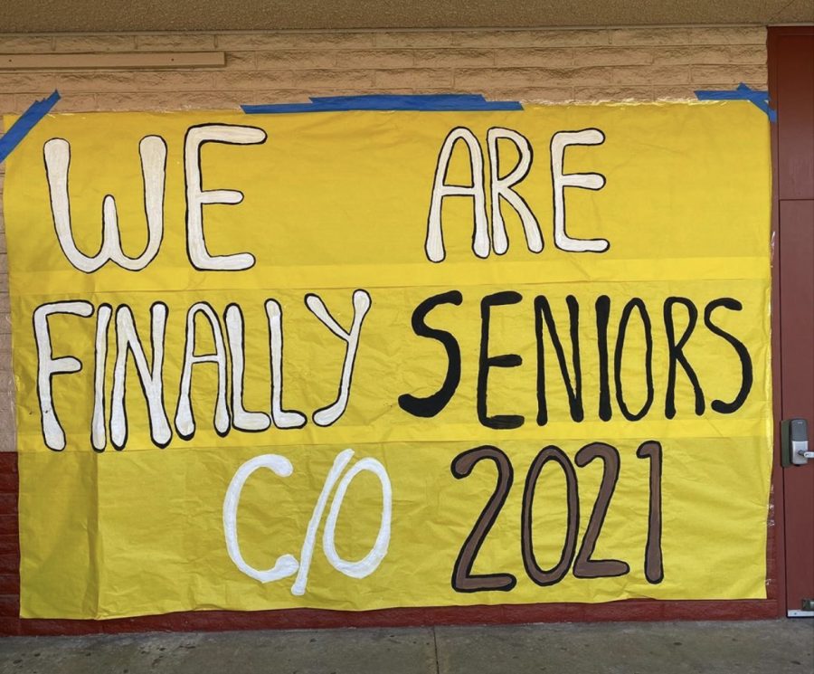 A We are finally seniors c/o 2021 poster is posted on the wall at the school. Students created posters to welcome the seniors back to school.