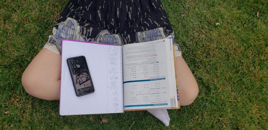 A student is doing homework while listening to music. (Photo courtesy: Megan Robinson).