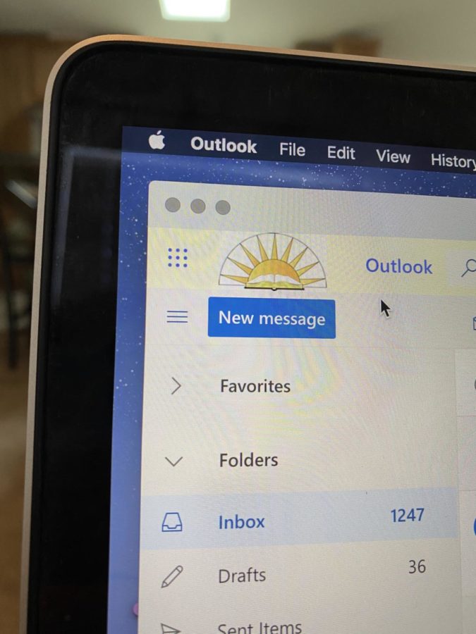 Camila Aguero-Salas, junior, opens Outlook, the primary application for checking students emails. This action has become especially important during virtual learning.