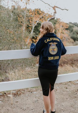 Sydney Marich has her back turned from the camera showcasing her FFA jacket while overlooking a scenic view. When things were going south I had to look past that and think, okay everyone else is experiencing this as well, its across the board, so Im not alone, says Sydney.