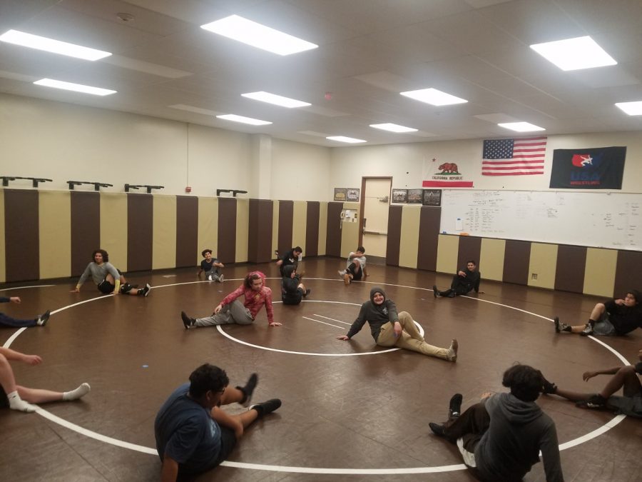 The Don Lugo Wrestlers are stretching and warming up for their practice, preparing for the demanding season ahead. I am very excited for new coaches and what they can provide to me to benefit my skills, said Sammuel Sanchez.