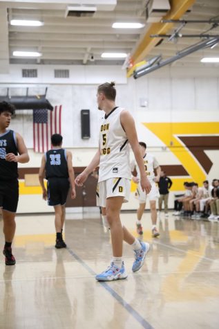 Don Lugo runs to the oppsosite side of the court to play offense. Don Lugo won this game against Montclair High School 52-46. We still have the rest of the season to look forward to and we do play Chino again at the end of the season, said Luke Kemble