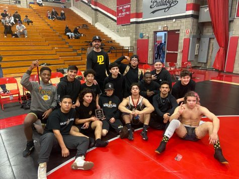 Don Lugo Wrestling posing for a photo after their performance at Ayala High School. What drives us on the mat is a CIF championship, stated Will Young.  