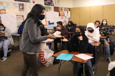 Students in Ms. Kuttikattuparambils class receive their COVID-19 rapid tests during sixth period. Test kits will be sent home with students on January 20, 2022, says Principal, Dr. Wong.