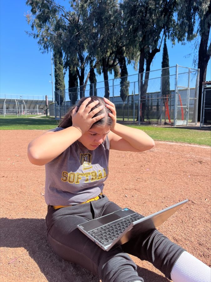 Malena Villa is stressed with homework right before the start of practice. 