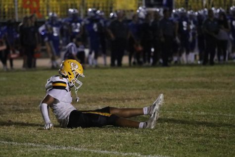 One of our football players sitting on the floor after a hard hit.