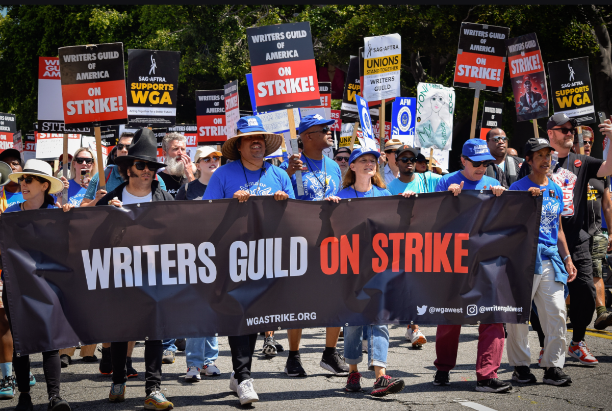 Writers guild members strike at picket line. This photo is under the creative commons usage licence.